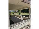 Covered patio with a view of the well-maintained lawn at 10617 W Deanne Dr, Sun City, AZ 85351