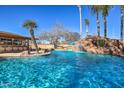 Resort style pool with waterfall and swim-up bar at 6614 W Sweetwater Ave, Glendale, AZ 85304