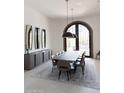 Elegant dining room with a long table and modern pendant lights at 6271 E Horseshoe Rd, Paradise Valley, AZ 85253