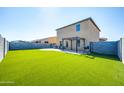 Artificial turf backyard with pergola and patio at 662 W 11Th St, Florence, AZ 85132