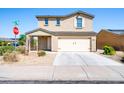 Two-story house with a two-car garage and neutral-colored exterior at 662 W 11Th St, Florence, AZ 85132