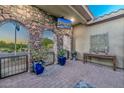 Covered patio with stonework, potted plants, and a view at 12789 W Via Caballo Blanco --, Peoria, AZ 85383