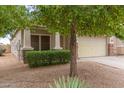 House exterior with a two car garage and manicured landscaping at 29759 N Desert Angel Dr, San Tan Valley, AZ 85143