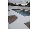 Newly resurfaced pool with clean lines and a large deck at 3418 E Montecito Ave, Phoenix, AZ 85018