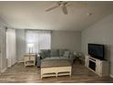 Living room with light teal sofa and coffee table at 120 N Val Vista Dr # 10, Mesa, AZ 85213