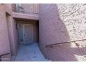 Condo entryway with security door and stairs leading up at 7329 N Via Camello Del Norte -- # 117, Scottsdale, AZ 85258