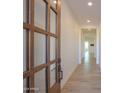 Bright and airy entryway with wood door and tile flooring at 1579 N Himosa Dr, Casa Grande, AZ 85122