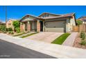 Craftsman style home with a two-car garage and landscaped yard at 28001 N 92Nd Ave, Peoria, AZ 85383