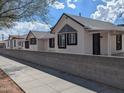 Three charming renovated homes situated side-by-side at 1037 E Moreland St, Phoenix, AZ 85006