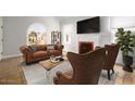 Living room with fireplace, large window and stylish furniture at 1547 W Vernon Ave, Phoenix, AZ 85007