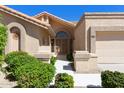 Front entrance of a charming single-story home at 9214 W Kerry Ln, Peoria, AZ 85382