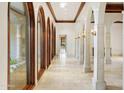 Long hallway with arched windows and marble flooring at 6324 N 48Th Pl, Paradise Valley, AZ 85253