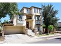 Three-story home with a two-car garage and stonework at 4306 E Tyson St, Gilbert, AZ 85295