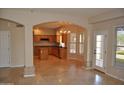 Kitchen with island, wood cabinets, and tile flooring at 11239 E Oberlin Way, Scottsdale, AZ 85262