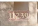 House number 11239 displayed on a stone plaque at 11239 E Oberlin Way, Scottsdale, AZ 85262