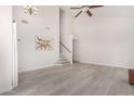 Spacious living room with vaulted ceiling, hardwood floors and staircase at 10654 E Forge Ave, Mesa, AZ 85208