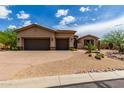 Two-car garage and front facade of a single-story house at 37143 N Greythorn Cir, Carefree, AZ 85377