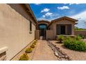 Brick walkway leads to the entrance of a beautiful home with desert landscaping at 37143 N Greythorn Cir, Carefree, AZ 85377