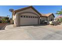 Two-car garage with ample space and a clean, well-maintained driveway at 1509 E Peach Tree Dr, Chandler, AZ 85249