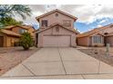 Two-story stucco home with a two-car garage and desert landscaping at 2737 S 156Th Ave, Goodyear, AZ 85338