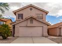 Two-story stucco home with a two-car garage and driveway at 2737 S 156Th Ave, Goodyear, AZ 85338