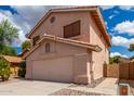 Two-story stucco home with a two-car garage and a walkway at 2737 S 156Th Ave, Goodyear, AZ 85338