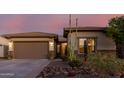 Single-story home with a two-car garage and desert landscaping at 18211 W Sequoia Dr, Goodyear, AZ 85338