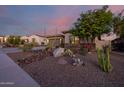 Single-story home with a two-car garage and desert landscaping at 18211 W Sequoia Dr, Goodyear, AZ 85338