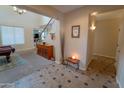 Home entryway with tile floors and view into game room at 4254 S Winter Ln, Gilbert, AZ 85297