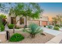 Charming desert landscaping and two-car garage at 6069 E Knolls S Way, Cave Creek, AZ 85331