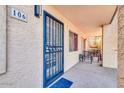 Condo entry with a blue security door and access to a private patio at 7502 E Carefree Dr # 106, Carefree, AZ 85377