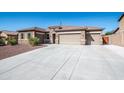 Single-story home with two-car garage at 43856 N Hudson Trl, New River, AZ 85087
