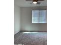 Bright bedroom with ceiling fan and neutral decor at 5513 W San Gabriel Ave, Laveen, AZ 85339