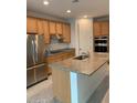 Modern kitchen with island and stainless steel appliances at 5513 W San Gabriel Ave, Laveen, AZ 85339