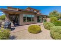 Landscaped backyard with patio, fire pit and grill at 36131 N Desert Tea Dr, Queen Creek, AZ 85140