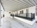 Spacious covered patio with storage and access to the home at 155 S Limestone Dr, Apache Junction, AZ 85119
