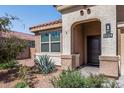 Home exterior showcasing front entrance and landscaping at 25334 W Maldonado Ct, Buckeye, AZ 85326