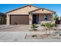 Single-story house with a two-car garage and desert landscaping at 24 S 175Th Ave, Goodyear, AZ 85338