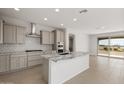 Modern kitchen with granite countertops and stainless steel appliances at 21396 N 270Th Ave, Buckeye, AZ 85396