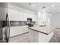 Modern kitchen with white cabinets and gray countertops at 901 S Smith Rd # 1012, Tempe, AZ 85281