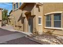 Townhouse style home with front entrance and walkway at 15240 N 142Nd Ave # 2111, Surprise, AZ 85379