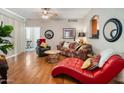 Living room with hardwood floors, stylish furniture, and a cozy atmosphere at 6900 E Princess Dr # 1136, Phoenix, AZ 85054