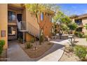 Complex exterior showing walkway, landscaping, and BBQ grills at 6900 E Princess Dr # 1136, Phoenix, AZ 85054