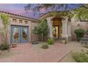 Charming courtyard entry with a peaceful atmosphere at 26348 N 104Th Way, Scottsdale, AZ 85255