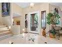 Elegant entryway with staircase and high ceilings at 26348 N 104Th Way, Scottsdale, AZ 85255