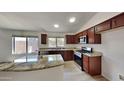 Modern kitchen with granite countertops and stainless steel appliances at 8758 E Obispo Ave, Mesa, AZ 85212