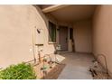 Covered entryway with door, small garden, and exterior lights at 846 N Pueblo Dr # 126, Casa Grande, AZ 85122