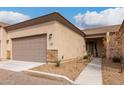 Tan colored home with a two-car garage and walkway at 846 N Pueblo Dr # 126, Casa Grande, AZ 85122