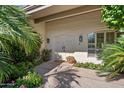 Inviting front entrance with double doors and lush landscaping at 6516 E Maverick Rd, Paradise Valley, AZ 85253