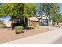 One-story home with a brown garage door at 696 E Trellis Rd, San Tan Valley, AZ 85140